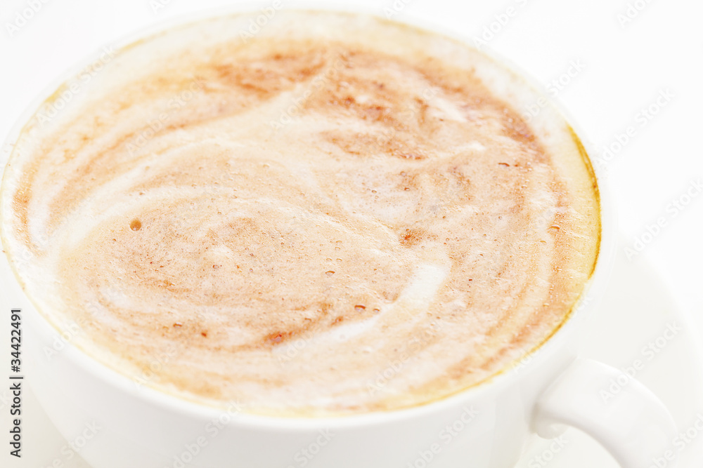 Obraz premium cappuccino in a cup isolated on white