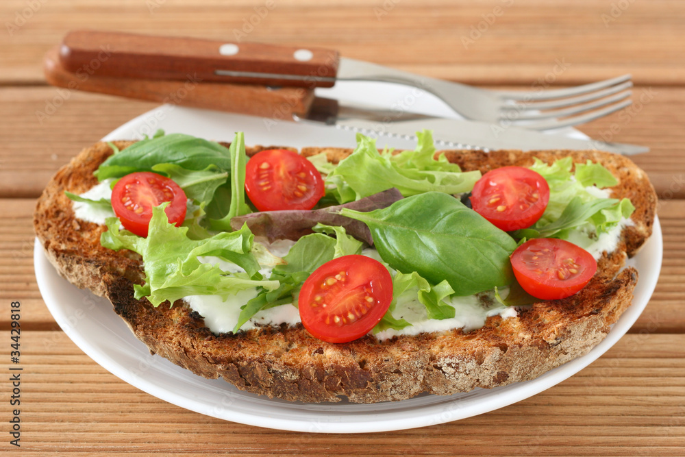 Toast with cream cheese, lettuce and tomato