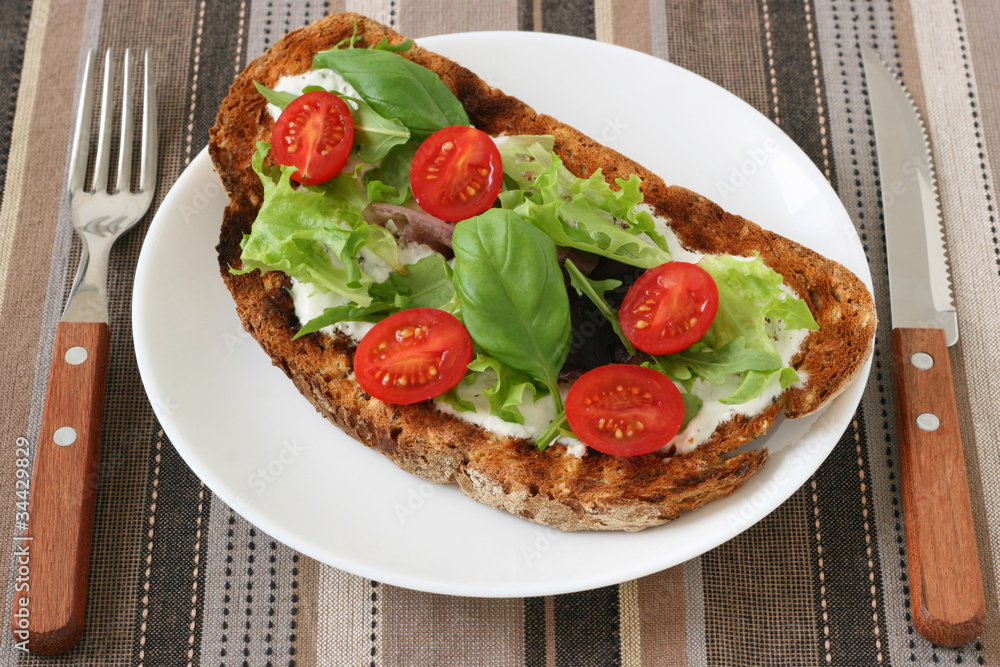 Toast with cream cheese, lettuce and tomato