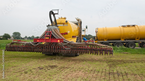The tank of the manure injector is being filled
