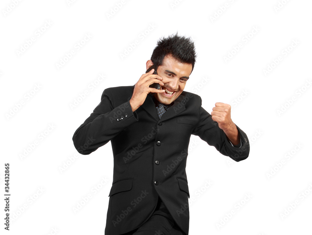 happy businessman talking over the cell phone happy businessman talking over the cell phone