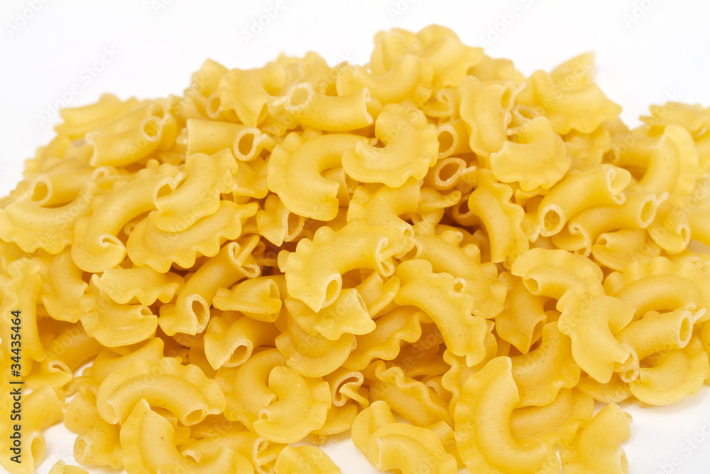close up of a dried italian pasta on white background close up of a dried italian pasta on white background