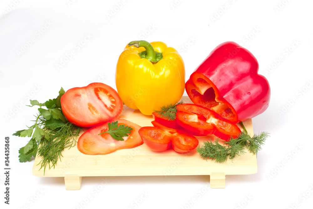 Pepper, tomato with dill and parsley on the wood desk isolated Pepper, tomato with dill and parsley on the wood desk isolated