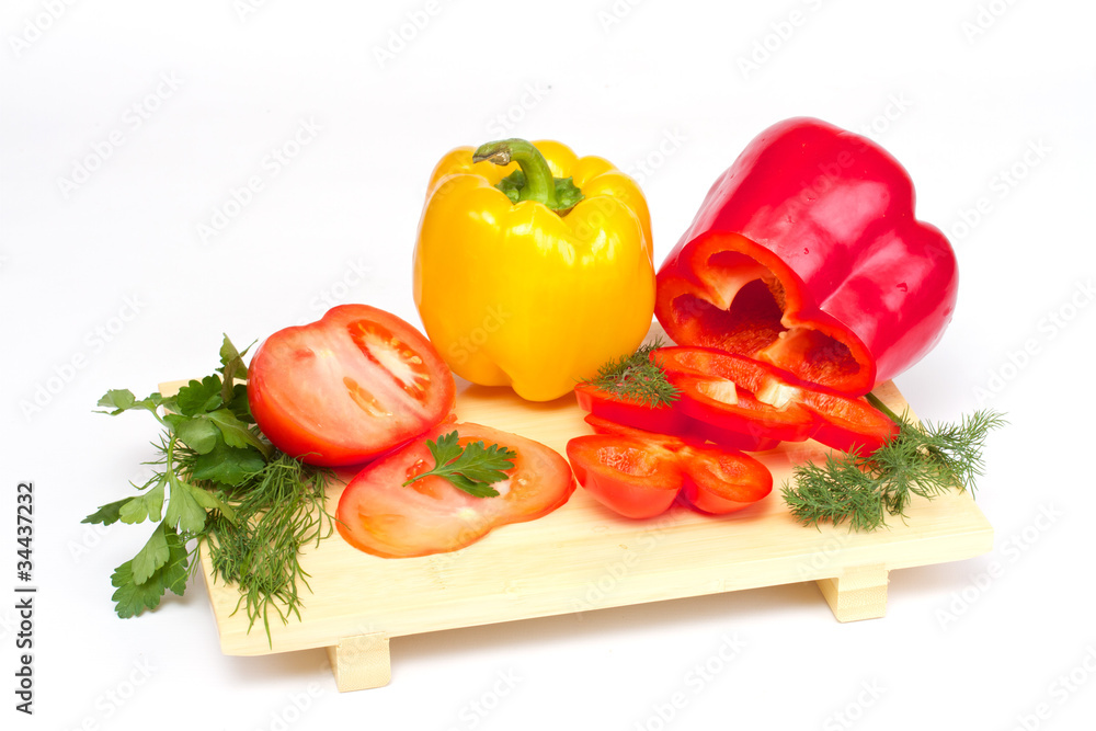 Pepper, tomato with dill and parsley on the wood desk isolated Pepper, tomato with dill and parsley on the wood desk isolated