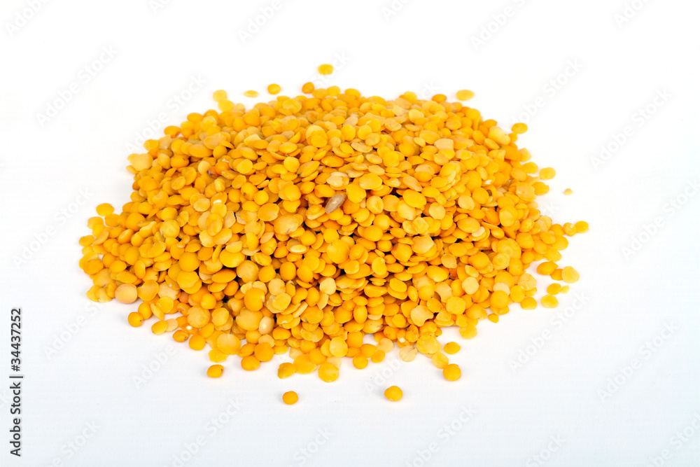 Yellow lentils isolated on white background.Macro shot. Yellow lentils isolated on white background.Macro shot.
