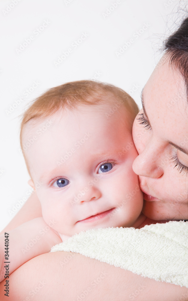 Young mum holds on hands of the chest baby Young mum holds on hands of the chest baby