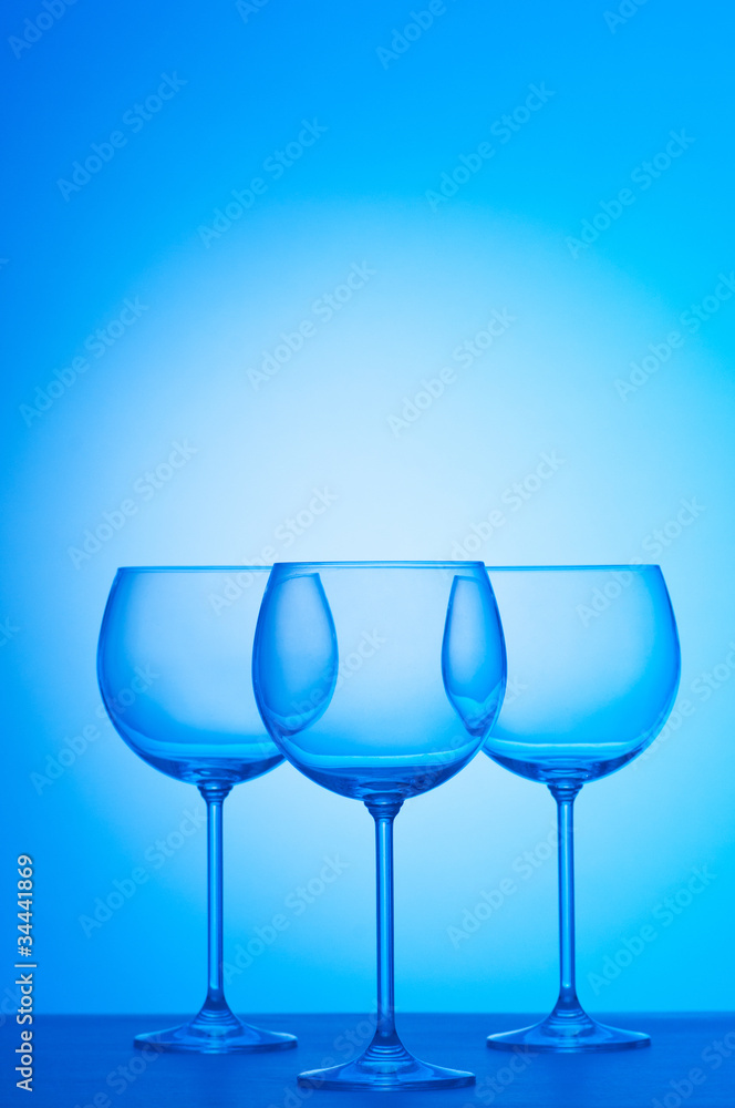 Wine glasses against gradient background Wine glasses against gradient background