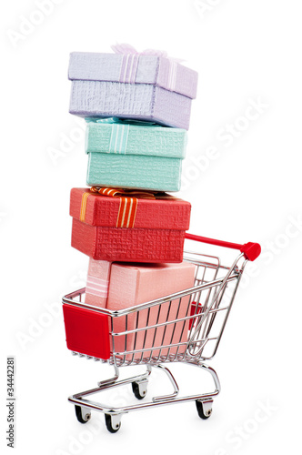 Shopping cart and giftboxes on white