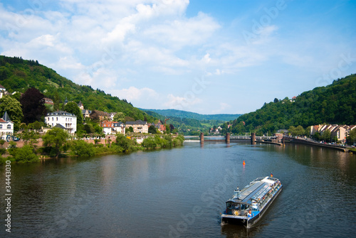 Tourist boat on Neckar river in Heidelberg