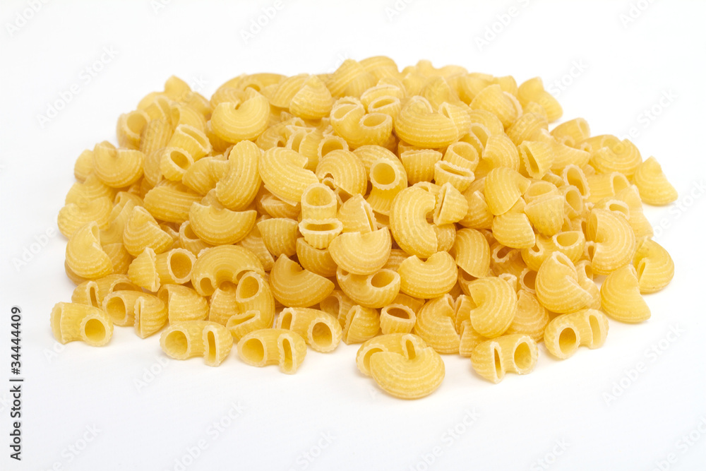 close up of a dried italian pasta on white background close up of a dried italian pasta on white background