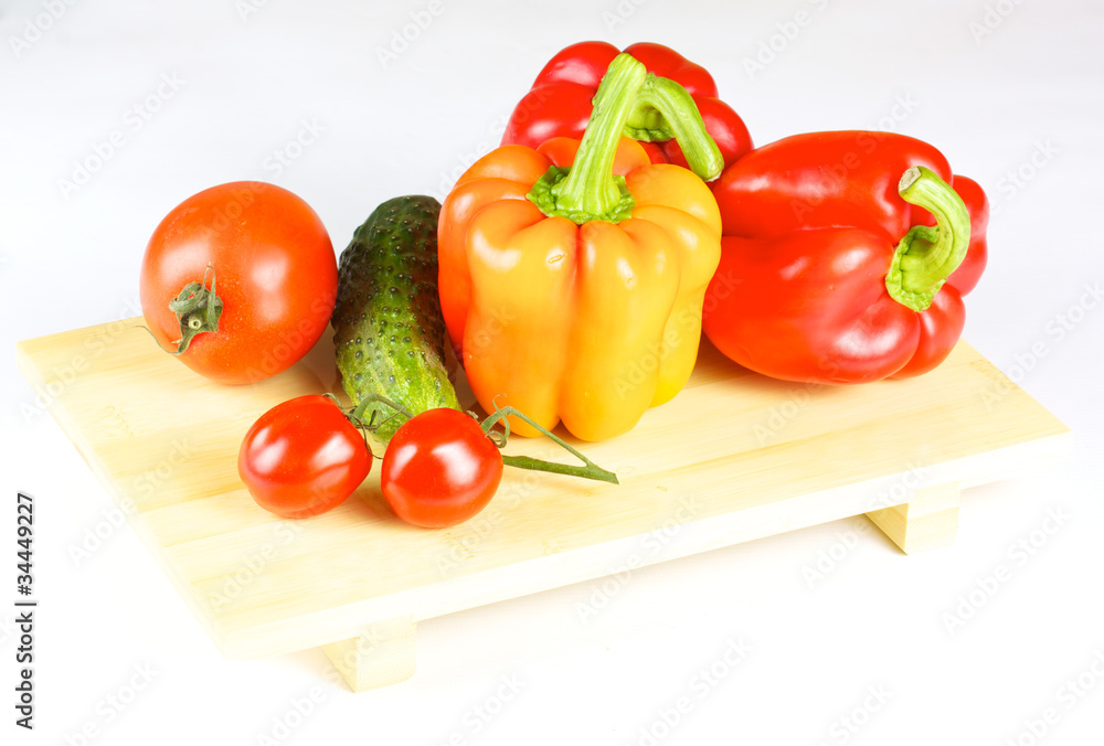 fresh and juicy vegetables on the wood plate isolated fresh and juicy vegetables on the wood plate isolated