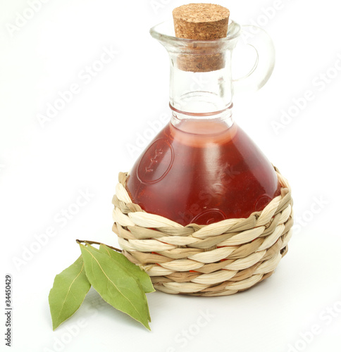 vinegar bottle and laurel leaf