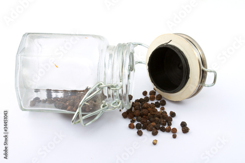a pile of peppercorns in the bottle