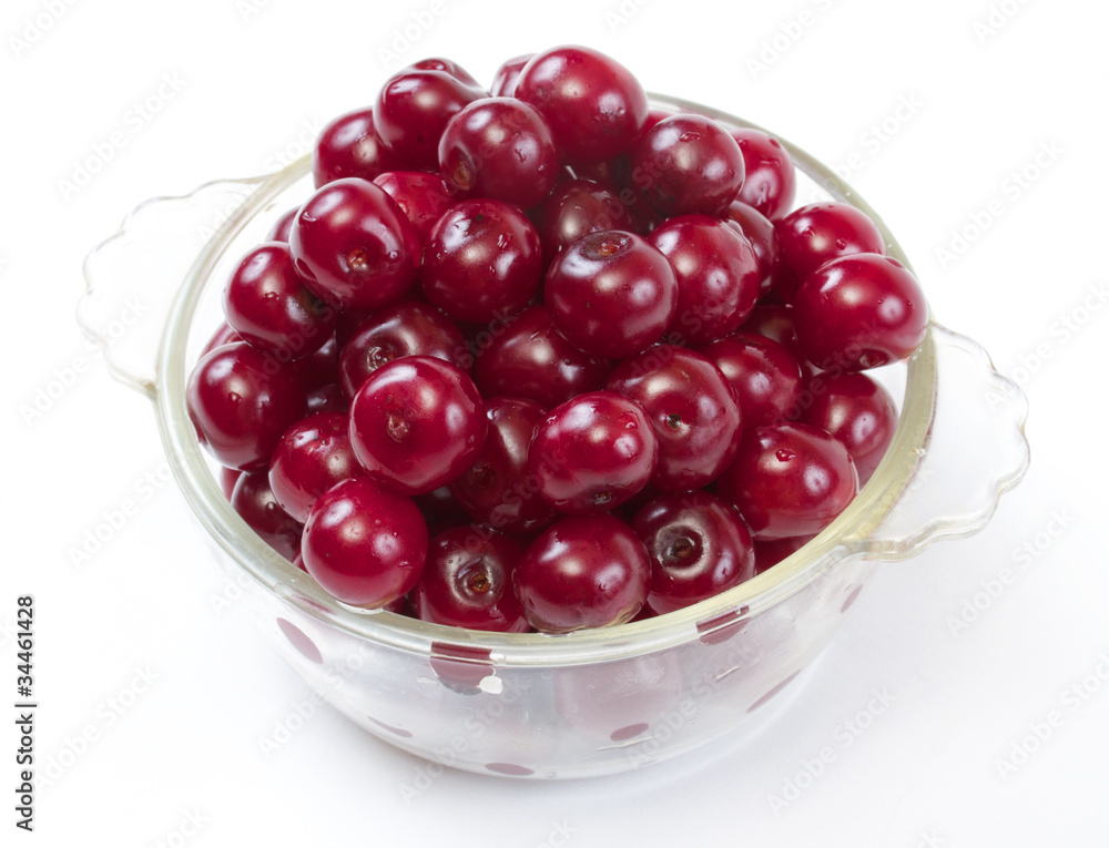Bowl with ripe cherries. Isolated on a white background. Bowl with ripe cherries. Isolated on a white background.