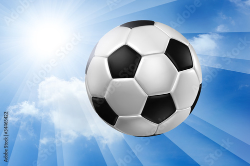 Football against blue sky