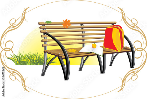 Backpack and book on the wooden bench