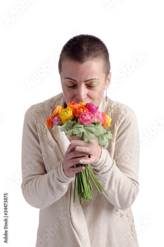 woman smelling bouquet or flowers