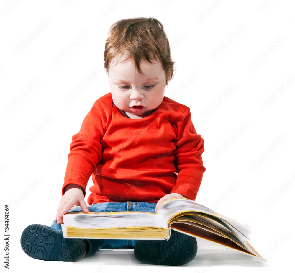 little boy reads the book interestedly little boy reads the book interestedly