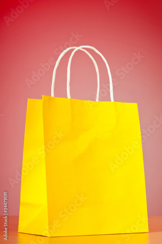 Shopping bags against gradient background