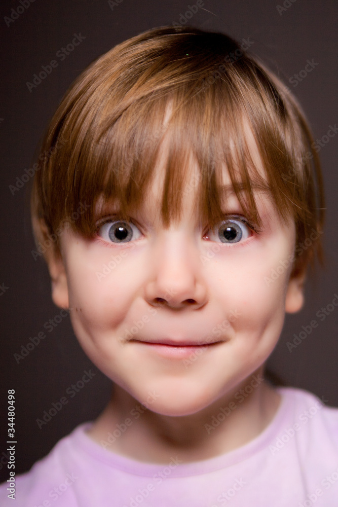 Portrait of a child on a black background. Portrait of a child on a black background.
