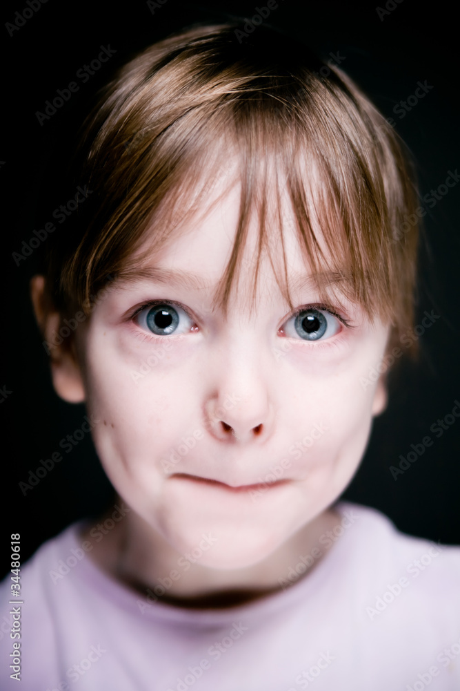 Portrait of a child on a black background. Portrait of a child on a black background.