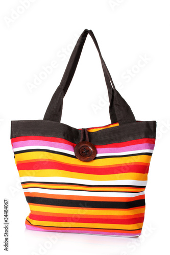 bright striped beach bag isolated on white