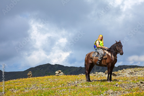 Female tourist on horseback