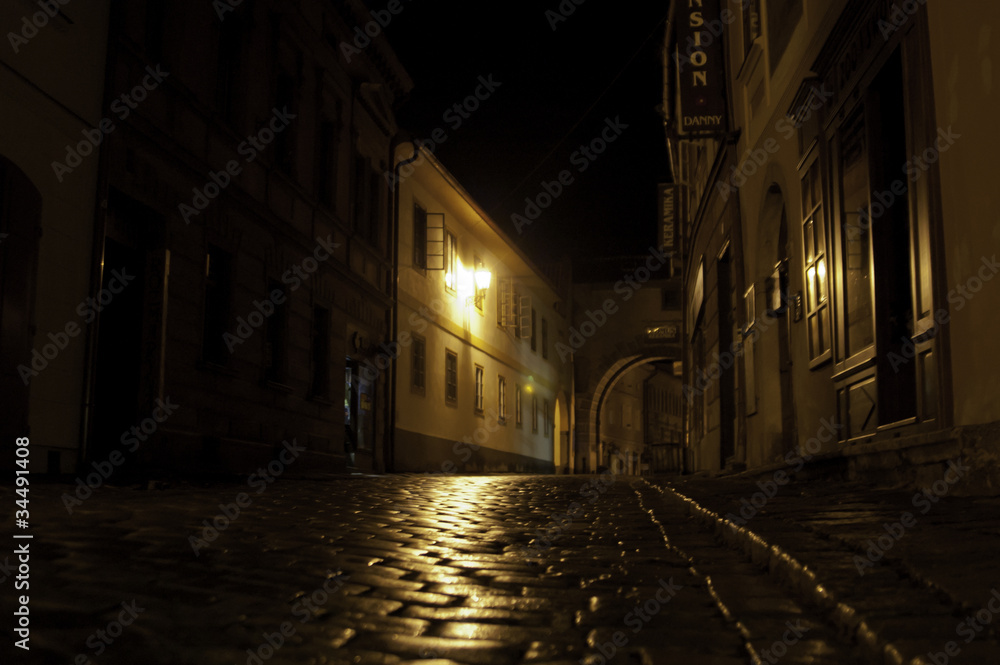 European street at night after rain