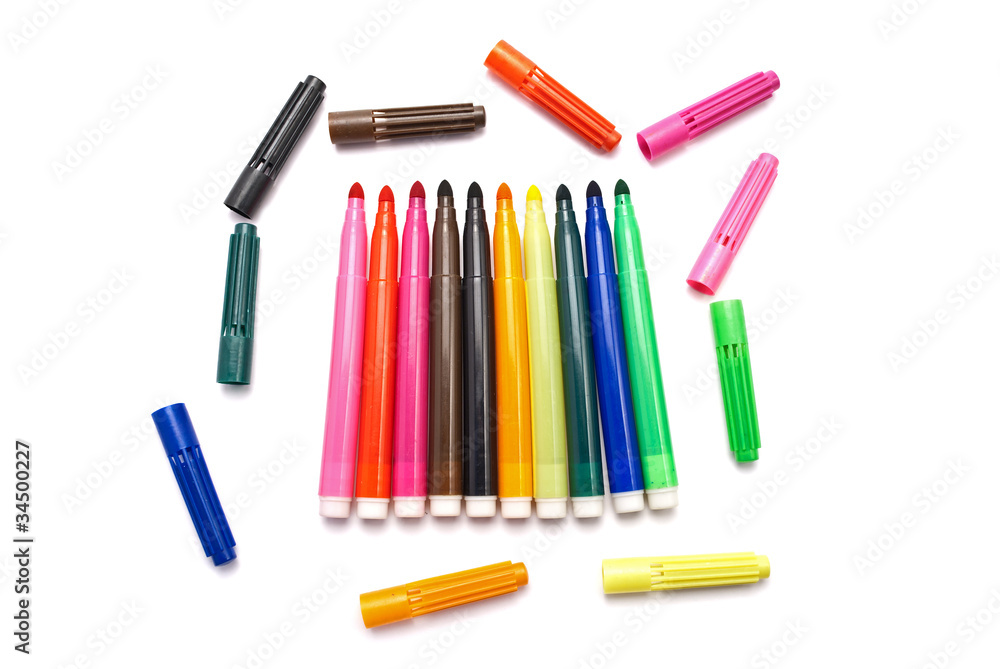 Сolored markers with caps, isolated on white. Сolored markers with caps, isolated on white.