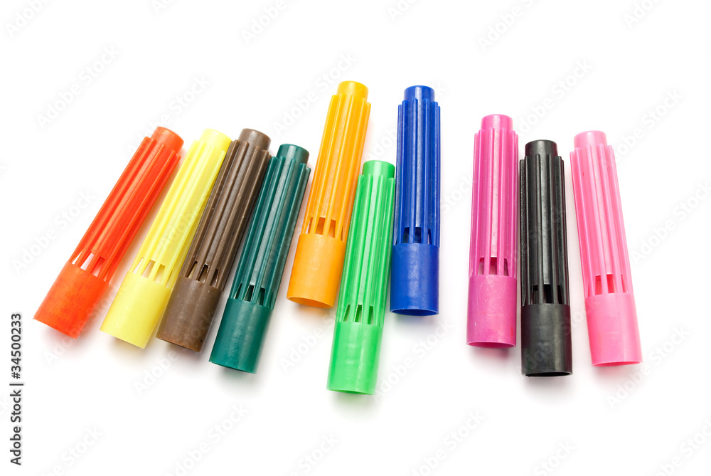 Colorful caps from markers, isolated on white.