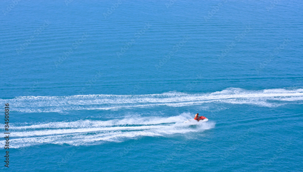 jetski racing on a blue water as background
