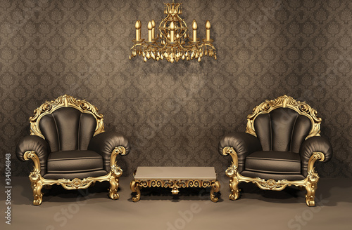 Armchairs with gold frame in old interior. Luxurious furniture.