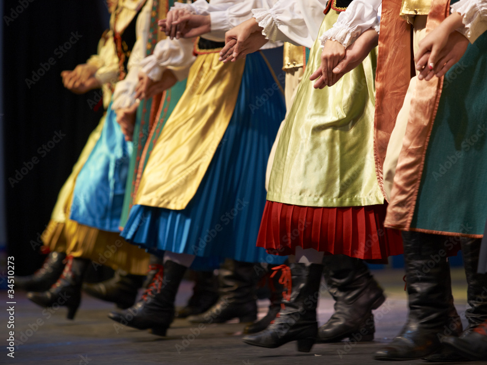 Low section of dancers wearing traditional clothing, Poland