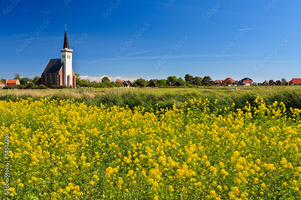 Church and flower field on a sunny day