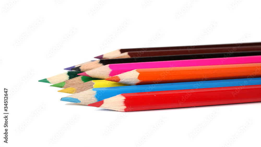 Many color pencils on a white background