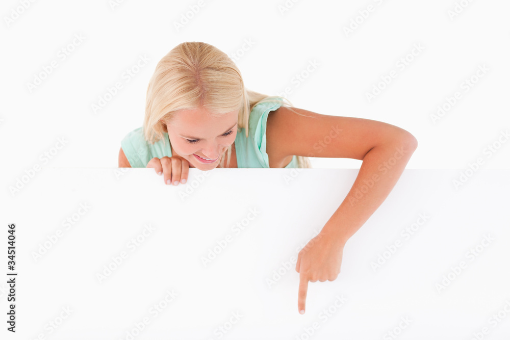 Woman pointing on a whiteboard Woman pointing on a whiteboard