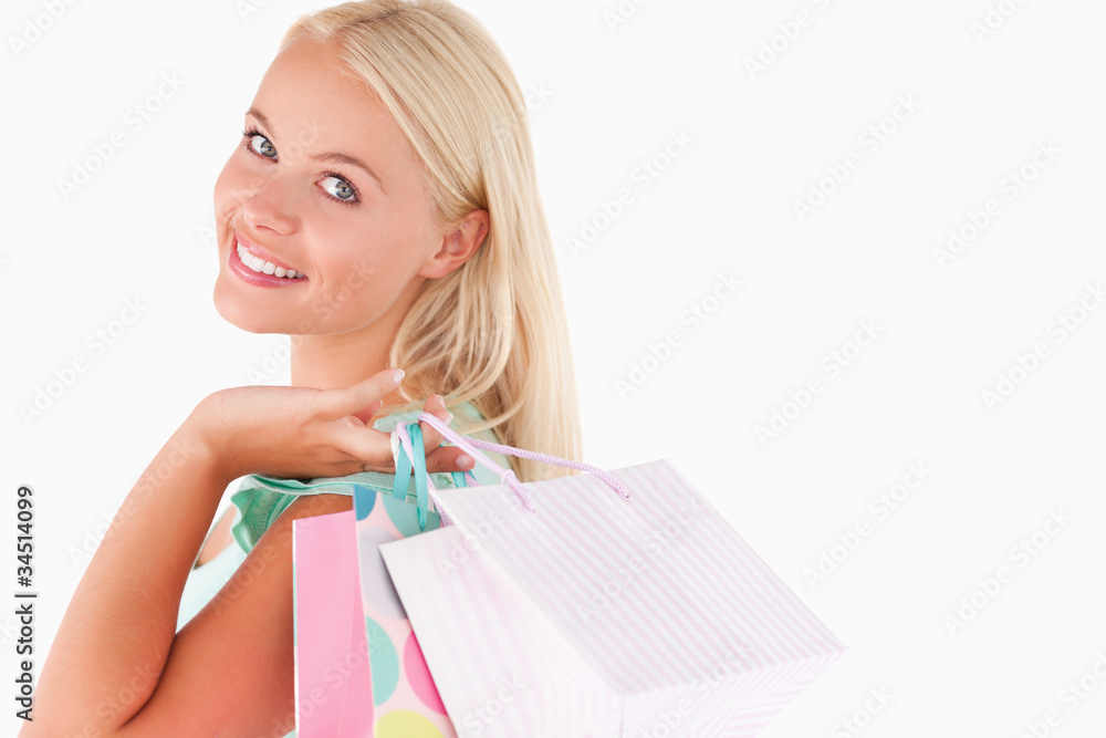 Portrait of a Joyful blond woman with shopping bags Portrait of a Joyful blond woman with shopping bags