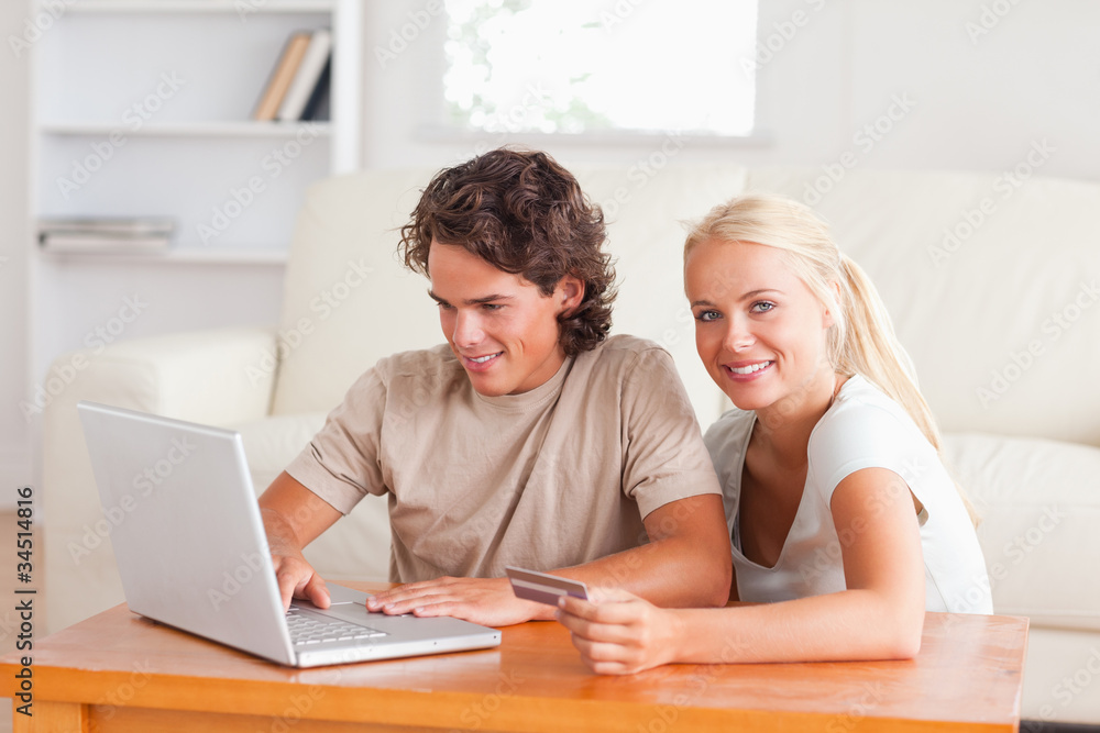 Happy couple with a laptop Happy couple with a laptop