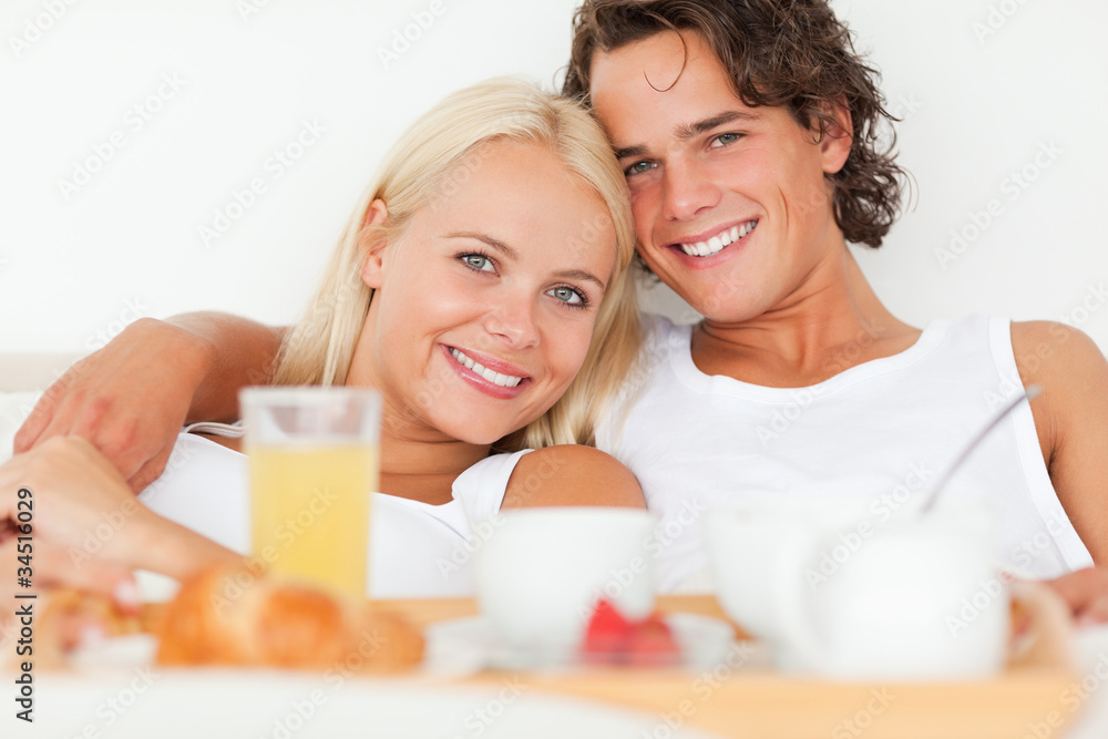 Close up of a smiling couple having breakfast Close up of a smiling couple having breakfast