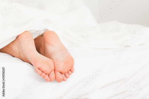 Two feet in a bed