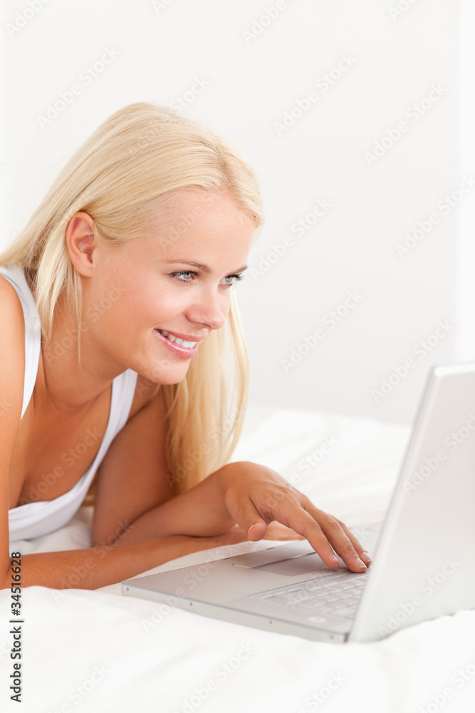 Portrait of a serene woman using a laptop Portrait of a serene woman using a laptop