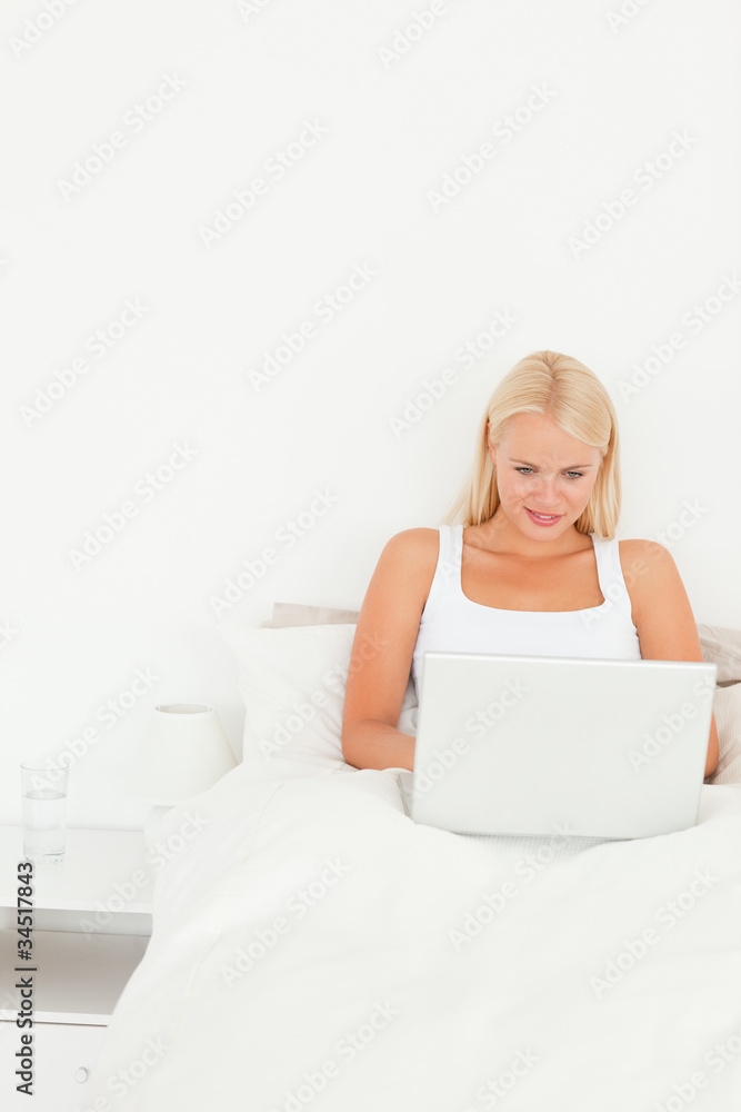 Smiling woman using a notebook Smiling woman using a notebook