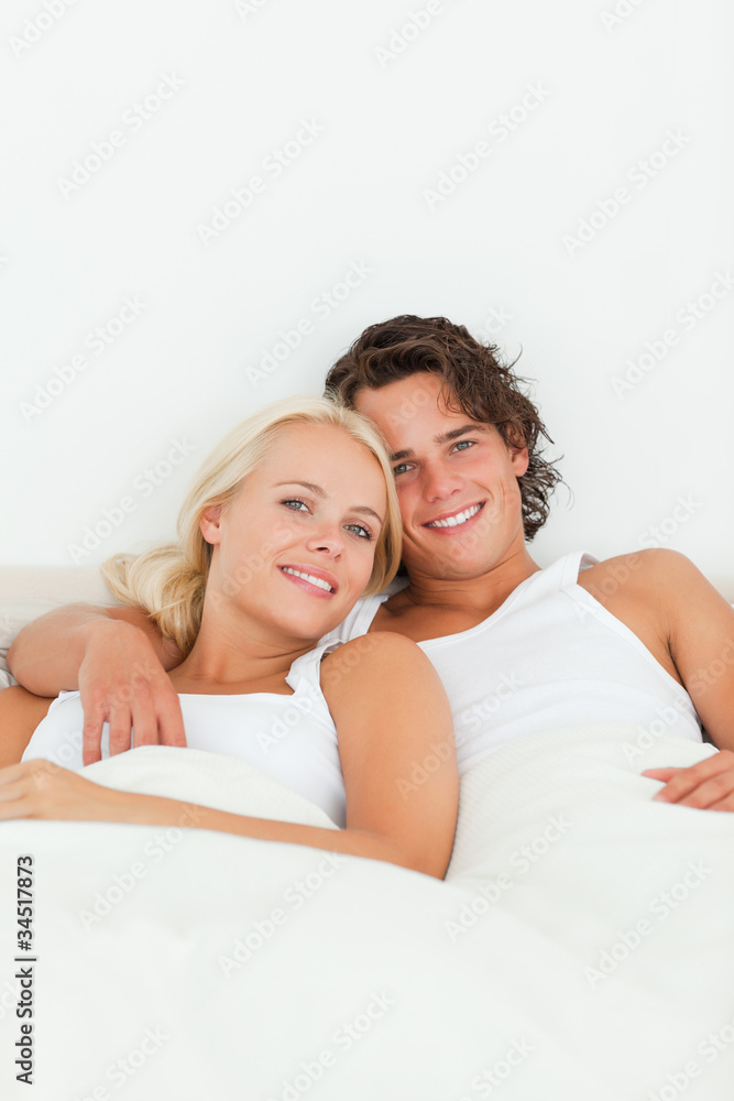 Portrait of a couple posing in their bedroom Portrait of a couple posing in their bedroom