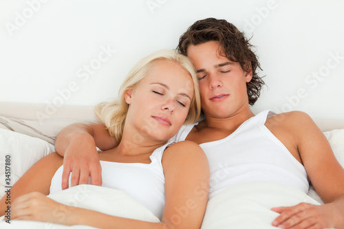 Couple sleeping in their bedroom