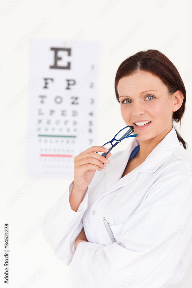 Gorgeous female optician with an eye test Gorgeous female optician with an eye test