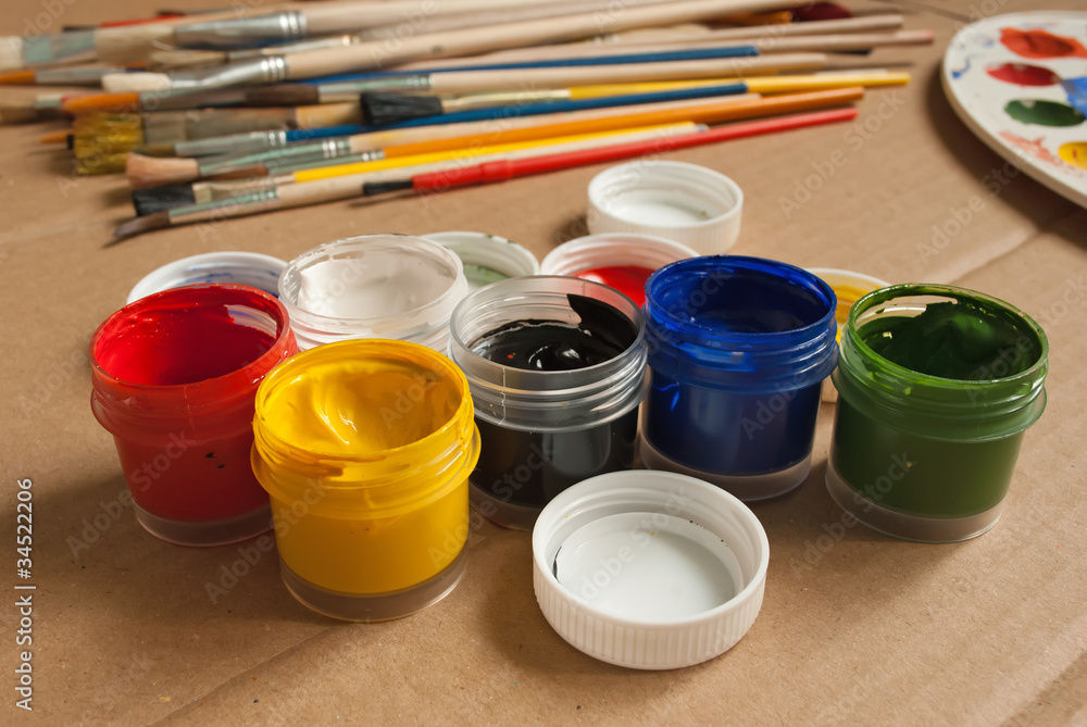 Open containers of paint in the workplace. Open containers of paint in the workplace.