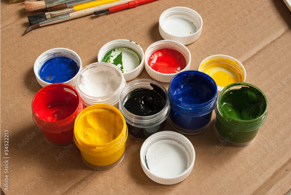Open containers of paint in the workplace. Open containers of paint in the workplace.