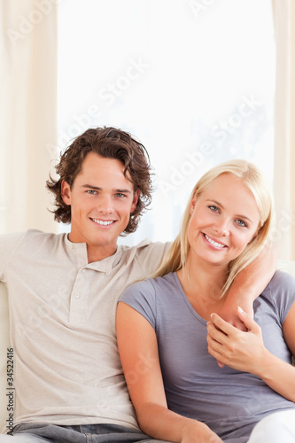 Portrait of a couple sitting on a sofa