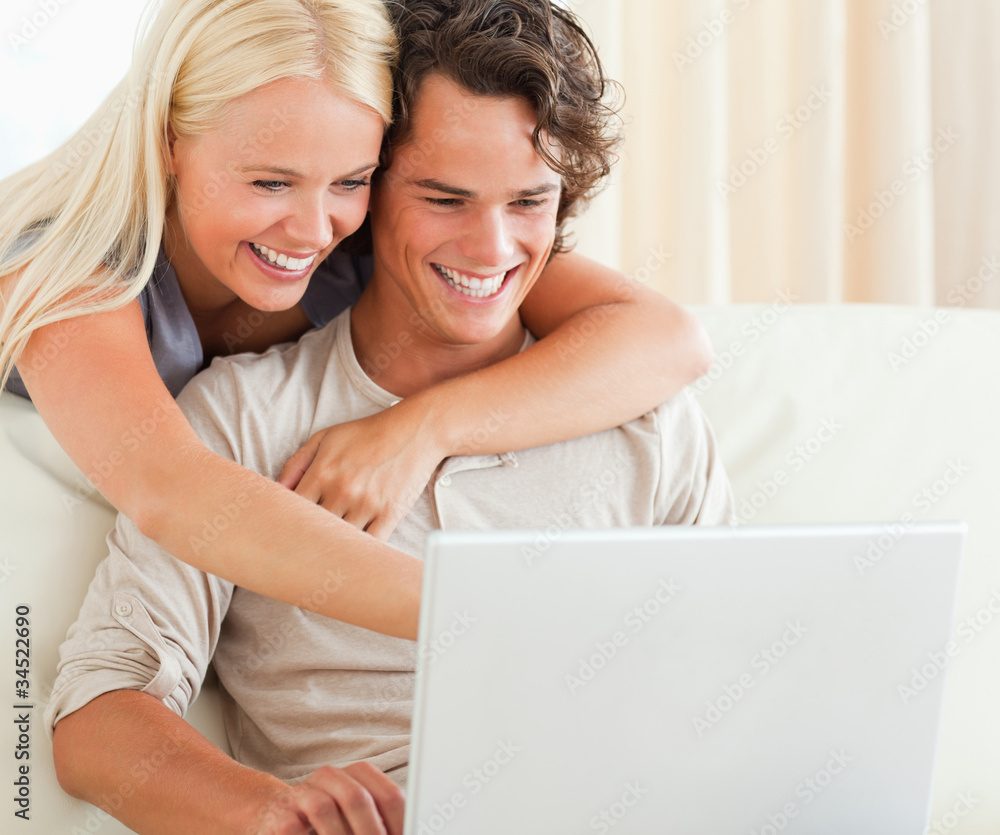 Couple using a laptop Couple using a laptop