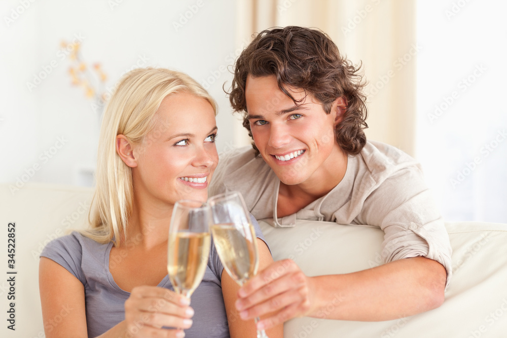 Beautiful couple making a toast Beautiful couple making a toast